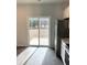 Kitchen with sliding door leading to backyard, hardwood floors and stainless steel appliances at 3005 Dalmore Dr, Ravenel, SC 29470