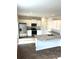 Modern kitchen with white cabinets, granite counters, and stainless steel appliances at 3005 Dalmore Dr, Ravenel, SC 29470