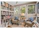 Cozy reading nook with two armchairs and built-in shelving at 3017 Ocean Winds Dr, Seabrook Island, SC 29455