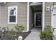 Front door entrance with a wreath and sidelights at 435 Eva St, Moncks Corner, SC 29461
