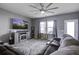 Living room with ceiling fan and large TV at 435 Eva St, Moncks Corner, SC 29461