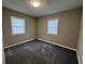 Bedroom with carpeted floor and two windows at 144 Butterfly Ln, Moncks Corner, SC 29461