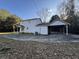 White house with carport and large backyard at 144 Butterfly Ln, Moncks Corner, SC 29461