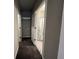 Hallway with carpet, leading to bathroom and other rooms at 144 Butterfly Ln, Moncks Corner, SC 29461
