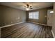 Bright living room with hardwood floors and window at 144 Butterfly Ln, Moncks Corner, SC 29461