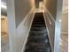 Carpeted staircase leading to the upper level at 144 Butterfly Ln, Moncks Corner, SC 29461
