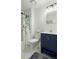 Well-lit bathroom with navy vanity, shower stall, and marble-look flooring at 195 Pine Shadow Dr, Goose Creek, SC 29445