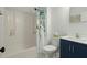 Clean bathroom with navy vanity, a shower/tub combo, and patterned shower curtain at 195 Pine Shadow Dr, Goose Creek, SC 29445