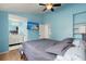 Serene bedroom with light blue walls, wooden bed frame, and ensuite bathroom at 195 Pine Shadow Dr, Goose Creek, SC 29445