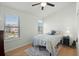 Charming bedroom with wood-look floors, window seating, and ceiling fan at 195 Pine Shadow Dr, Goose Creek, SC 29445