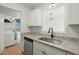 Kitchen with granite countertops, stainless steel appliances, and laundry access at 195 Pine Shadow Dr, Goose Creek, SC 29445