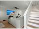 Living room with gray sectional sofa, fireplace, and stairs at 195 Pine Shadow Dr, Goose Creek, SC 29445
