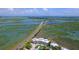 Aerial view of coastal community with marsh views and bridge access at 2111 Tides End Rd, Charleston, SC 29412