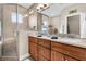 Double vanity bathroom with a walk-in shower and window at 2111 Tides End Rd, Charleston, SC 29412