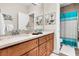 Double vanity bathroom with a walk-in shower and teal accents at 2111 Tides End Rd, Charleston, SC 29412