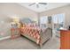 Bright bedroom with a queen bed, orange bedding, and plenty of natural light at 2111 Tides End Rd, Charleston, SC 29412
