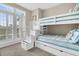 bedroom with a white bunk bed and ocean-themed decor at 2111 Tides End Rd, Charleston, SC 29412