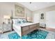 Main bedroom with a king bed, coastal decor, and water views at 2111 Tides End Rd, Charleston, SC 29412