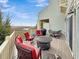 Deck with red seating, a fire pit table, and grill, overlooking the marsh at 2111 Tides End Rd, Charleston, SC 29412