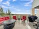 Deck with red seating, a fire pit table, and marsh views at 2111 Tides End Rd, Charleston, SC 29412
