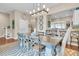 Spacious dining area with a large table, hardwood floors, and kitchen views at 2111 Tides End Rd, Charleston, SC 29412