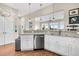 Kitchen boasts stainless steel appliances, granite counters and white cabinets at 2111 Tides End Rd, Charleston, SC 29412