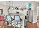 Kitchen features granite countertops, stainless steel appliances, and white cabinets at 2111 Tides End Rd, Charleston, SC 29412