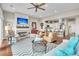 Bright living room features fireplace, hardwood floors, and open concept design at 2111 Tides End Rd, Charleston, SC 29412