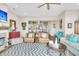 Living room boasts fireplace, hardwood floors, and view into the kitchen at 2111 Tides End Rd, Charleston, SC 29412