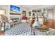 Open living room with fireplace, hardwood floors and kitchen access at 2111 Tides End Rd, Charleston, SC 29412