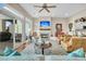 Spacious living room with fireplace, hardwood floors, and access to deck at 2111 Tides End Rd, Charleston, SC 29412