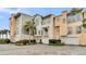 View of three-story townhomes and garages at 2111 Tides End Rd, Charleston, SC 29412