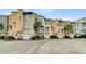 Exterior view of charming townhomes with garages at 2111 Tides End Rd, Charleston, SC 29412