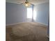 Upstairs bedroom with ceiling fan and neutral carpet at 4743 Skillmaster Ct, North Charleston, SC 29418