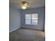 Spacious bedroom with ceiling fan and neutral carpeting at 4743 Skillmaster Ct, North Charleston, SC 29418