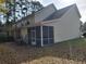 Tan two story home with screened porch at 4743 Skillmaster Ct, North Charleston, SC 29418