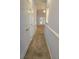 Long hallway with neutral carpeting and doors at 4743 Skillmaster Ct, North Charleston, SC 29418