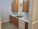 Kitchen with wood cabinets, white appliances and flooring at 4743 Skillmaster Ct, North Charleston, SC 29418
