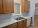 Kitchen with wood cabinets, white appliances and flooring at 4743 Skillmaster Ct, North Charleston, SC 29418