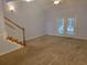 Spacious living room with neutral carpeting and French doors at 4743 Skillmaster Ct, North Charleston, SC 29418