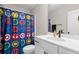 Modern bathroom with white vanity and superhero shower curtain at 655 Black Pine Rd, Moncks Corner, SC 29461