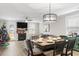 Dining area with a wooden table, six chairs, and a farmhouse style at 655 Black Pine Rd, Moncks Corner, SC 29461