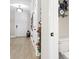 Bright entryway with wood floors, white door, and decorative wall gallery at 655 Black Pine Rd, Moncks Corner, SC 29461