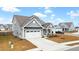 Gray two-story house with white garage door and side yard at 655 Black Pine Rd, Moncks Corner, SC 29461