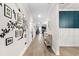 Bright hallway with wood floors and Gathering photos at 655 Black Pine Rd, Moncks Corner, SC 29461