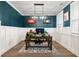 Home office with teal walls, wood floors, and a large desk at 655 Black Pine Rd, Moncks Corner, SC 29461
