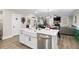 Modern kitchen island with white cabinets, quartz countertops, and farmhouse sink at 655 Black Pine Rd, Moncks Corner, SC 29461
