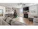 Living room featuring a fireplace, comfy seating, and a Christmas tree at 655 Black Pine Rd, Moncks Corner, SC 29461