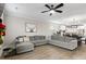 Open living room with sectional sofa, view into kitchen and dining area at 655 Black Pine Rd, Moncks Corner, SC 29461