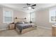 Main bedroom with king-size bed, wood headboard and ceiling fan at 655 Black Pine Rd, Moncks Corner, SC 29461
